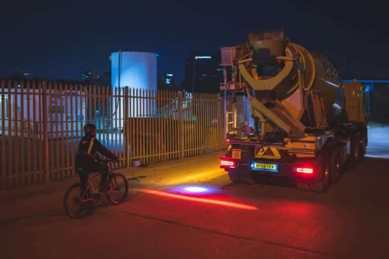 illuminated safety cycle lane keeping a cyclist safe behind a vehicle